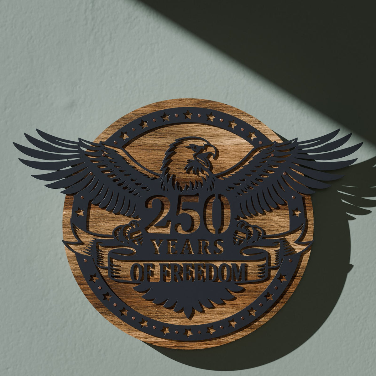 Eagle 250 Years of Freedom sign in matte black steel on a torched pine round with copper nail accents