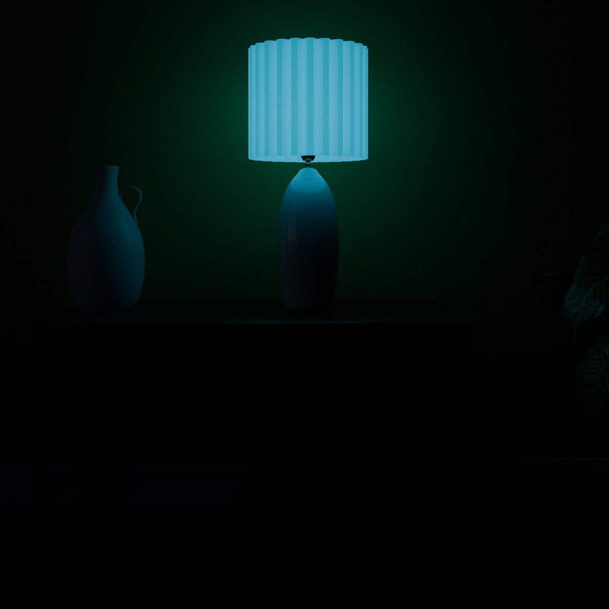 Glow Blue lamp shade glowing in a dark room with the lamp off